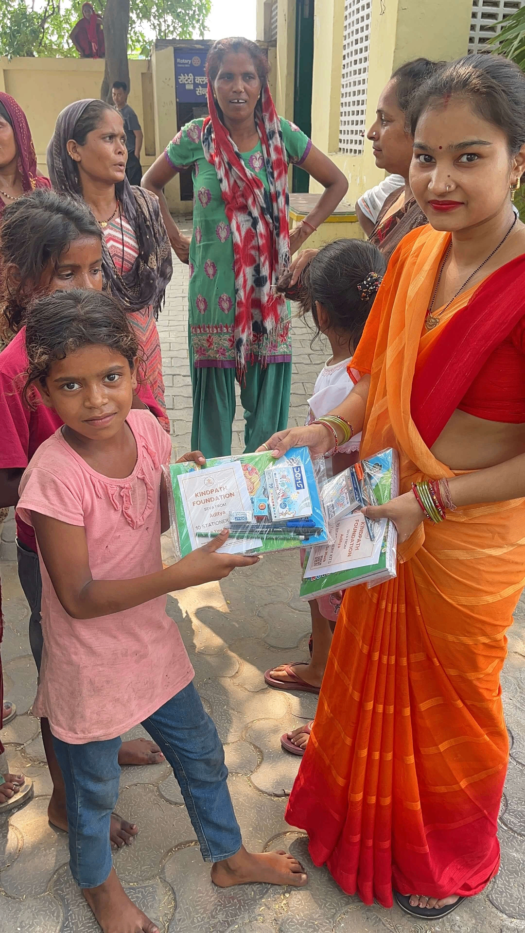 Riya smiling with her school stationery kit